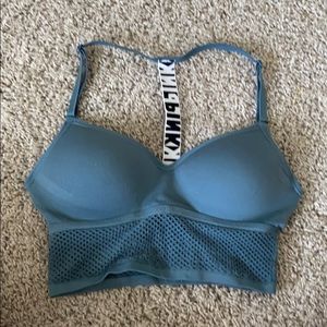 Pink fishnet Razorback sport bra